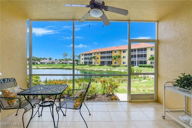 10020 Maddox Ln Unit 113, Bonita Springs, FL 34135 - sunroom / solarium featuring a ceiling fan and a water view