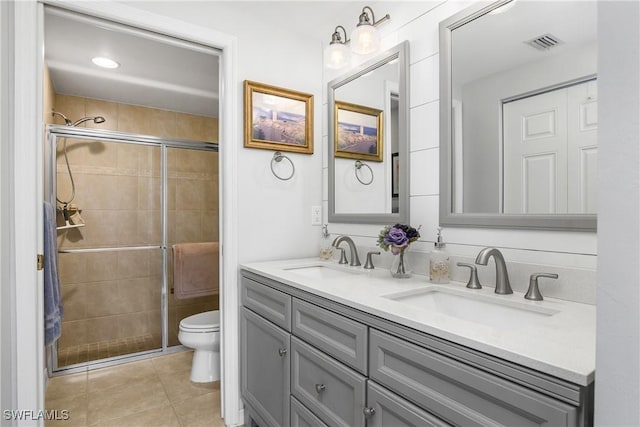 10020 Maddox Ln Unit 113, Bonita Springs, FL 34135 - full bathroom featuring double vanity, a stall shower, and tile patterned flooring