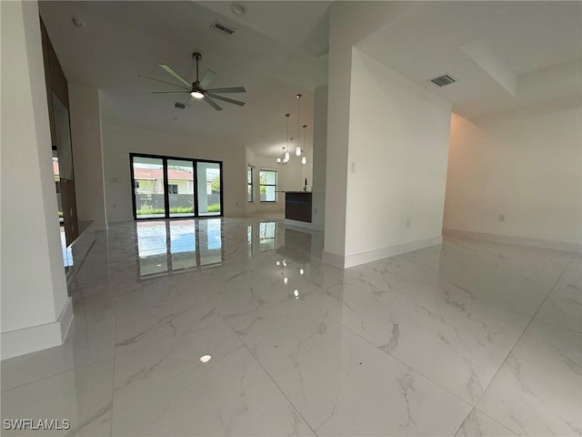 3508 17th St SW, Lehigh Acres, FL 33976 - unfurnished room with baseboards, marble tiled floors, and ceiling fan