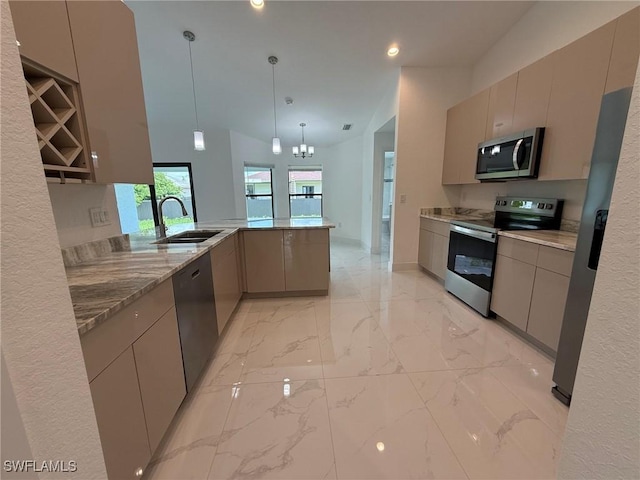 3508 17th St SW, Lehigh Acres, FL 33976 - kitchen featuring appliances with stainless steel finishes, a sink, a peninsula, light marble finish flooring, and pendant lighting