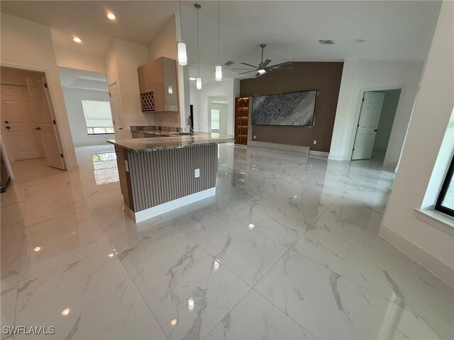 3508 17th St SW, Lehigh Acres, FL 33976 - kitchen with baseboards, light marble finish floors, plenty of natural light, a ceiling fan, and recessed lighting