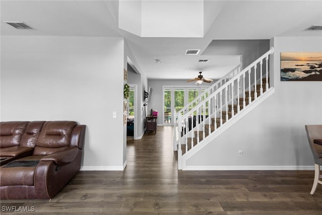 21314 Braxfield Loop, Estero, FL 33928 - living area featuring ceiling fan, baseboards, wood finished floors, and stairs