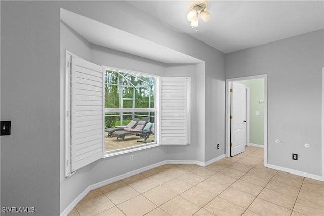 21314 Braxfield Loop, Estero, FL 33928 - unfurnished room with ceiling fan, baseboards, and light tile patterned floors