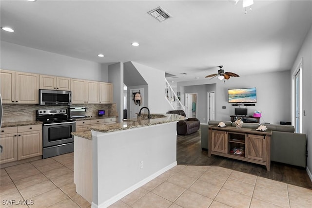 21314 Braxfield Loop, Estero, FL 33928 - kitchen featuring appliances with stainless steel finishes, open floor plan, a ceiling fan, light tile patterned floors, and recessed lighting