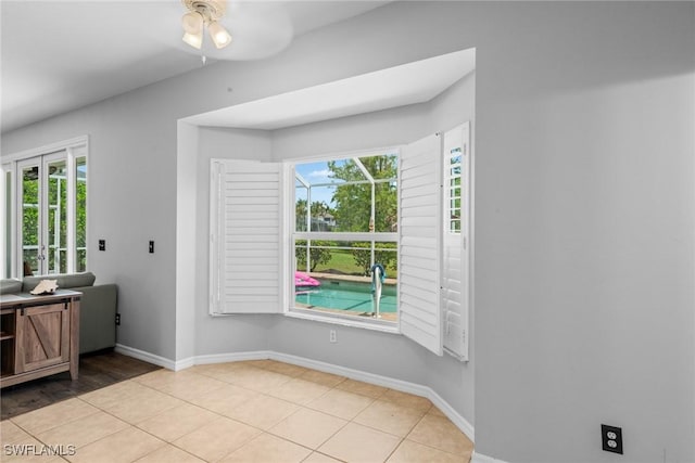 21314 Braxfield Loop, Estero, FL 33928 - unfurnished dining area featuring baseboards, a ceiling fan, and light tile patterned floors