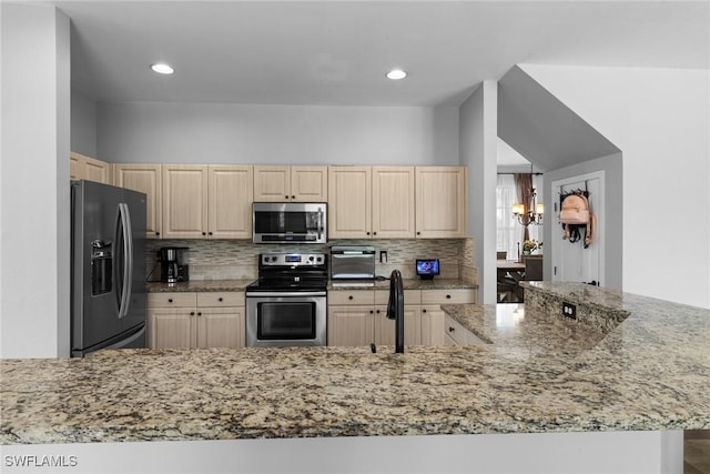 21314 Braxfield Loop, Estero, FL 33928 - kitchen with appliances with stainless steel finishes, light brown cabinetry, tasteful backsplash, light stone countertops, and recessed lighting