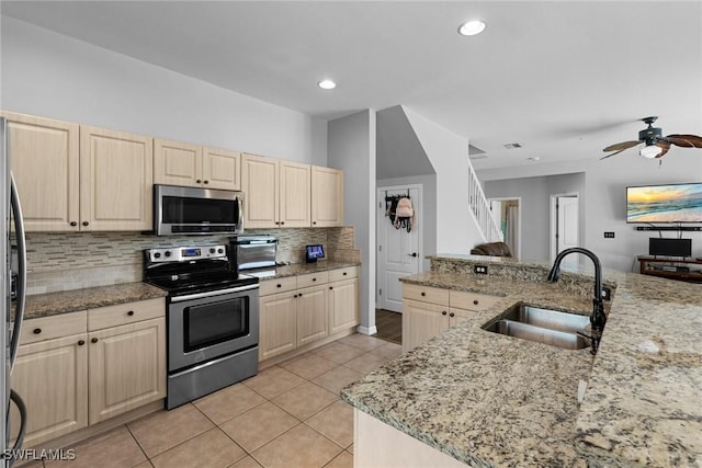 21314 Braxfield Loop, Estero, FL 33928 - kitchen featuring stainless steel appliances, a sink, light tile patterned flooring, tasteful backsplash, and a ceiling fan