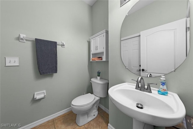 21314 Braxfield Loop, Estero, FL 33928 - bathroom with a sink, baseboards, toilet, and tile patterned floors