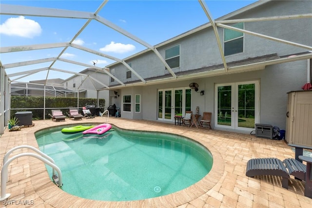 21314 Braxfield Loop, Estero, FL 33928 - view of swimming pool with french doors, a patio area, and glass enclosure