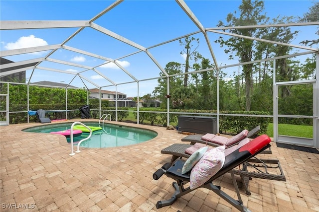 21314 Braxfield Loop, Estero, FL 33928 - swimming pool with a covered hot tub, a patio, and glass enclosure