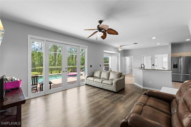 21314 Braxfield Loop, Estero, FL 33928 - living room featuring french doors, recessed lighting, ceiling fan, wood finished floors, and baseboards