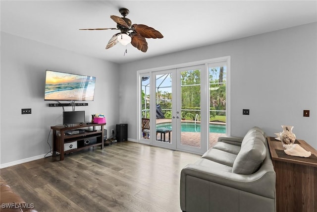 21314 Braxfield Loop, Estero, FL 33928 - living area with wood finished floors, ceiling fan, french doors, and baseboards