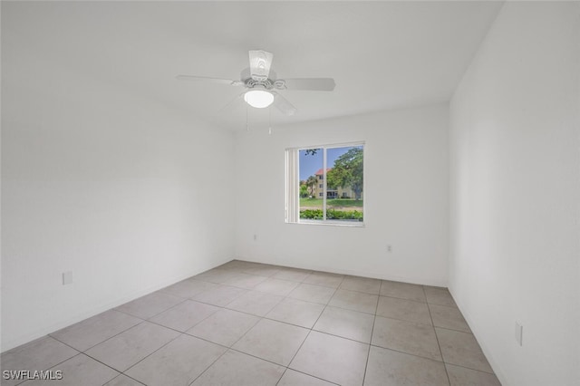 8244 Key Royal Cir Unit 615, Naples, FL 34119 - empty room with light tile patterned floors and a ceiling fan