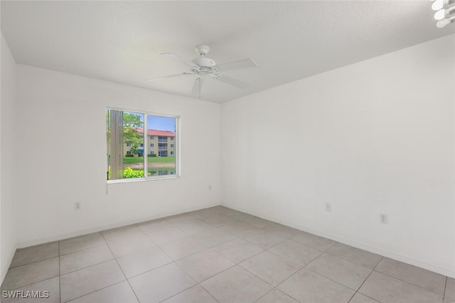 8244 Key Royal Cir Unit 615, Naples, FL 34119 - unfurnished room featuring a ceiling fan and light tile patterned floors