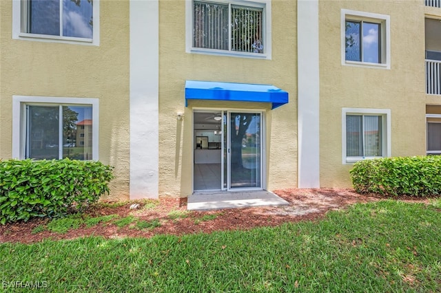 8244 Key Royal Cir Unit 615, Naples, FL 34119 - property entrance featuring stucco siding