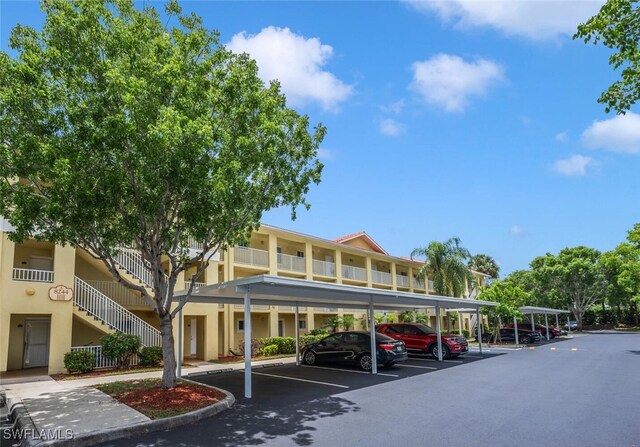 8244 Key Royal Cir Unit 615, Naples, FL 34119 - view of building exterior with covered parking