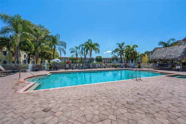 8244 Key Royal Cir Unit 615, Naples, FL 34119 - community pool featuring a patio area