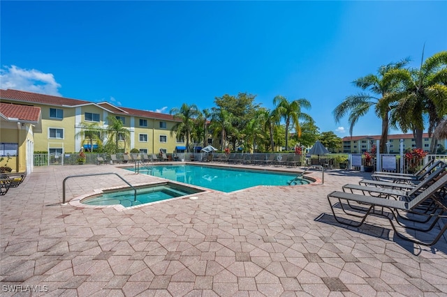 8244 Key Royal Cir Unit 615, Naples, FL 34119 - community pool with a patio and a hot tub