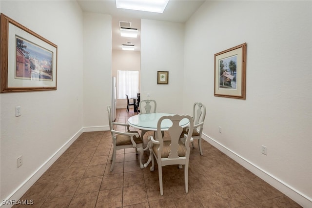 8244 Key Royal Cir Unit 615, Naples, FL 34119 - dining room with tile patterned floors and baseboards