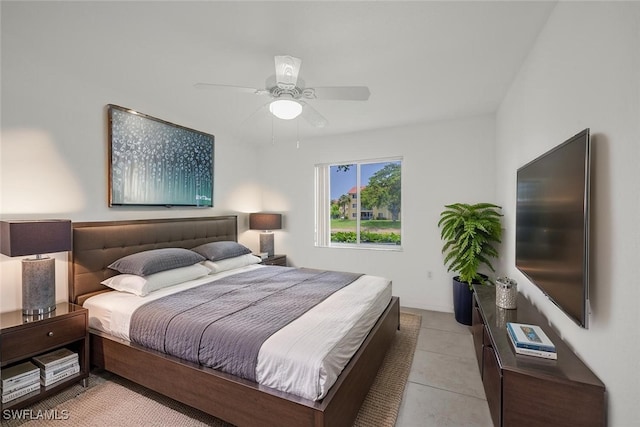 8244 Key Royal Cir Unit 615, Naples, FL 34119 - bedroom featuring ceiling fan and light tile patterned flooring