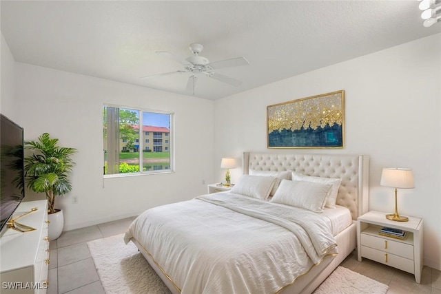 8244 Key Royal Cir Unit 615, Naples, FL 34119 - bedroom featuring light tile patterned flooring and a ceiling fan