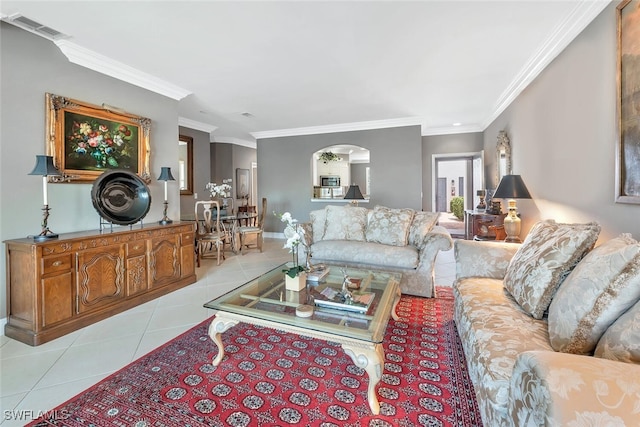 5963 Sand Wedge Ln Unit 203, Naples, FL 34110 - living area with light tile patterned flooring, ornamental molding, and arched walkways