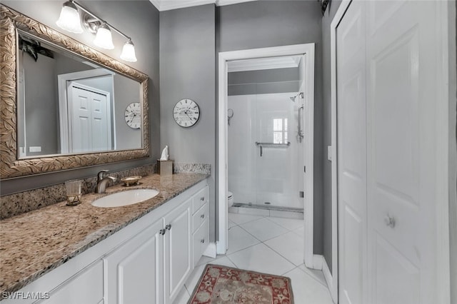 5963 Sand Wedge Ln Unit 203, Naples, FL 34110 - bathroom featuring vanity, a stall shower, tile patterned flooring, and a closet