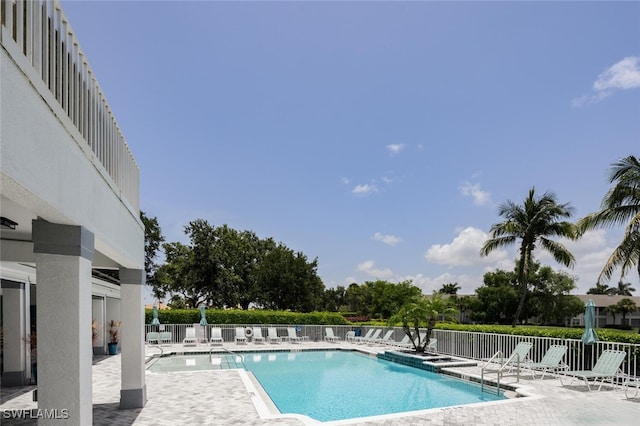 5963 Sand Wedge Ln Unit 203, Naples, FL 34110 - community pool with a patio area