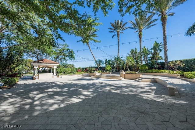 5963 Sand Wedge Ln Unit 203, Naples, FL 34110 - view of decorative driveway