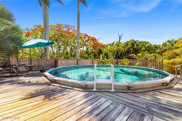 5228 Stringfellow Rd, Saint James City, FL 33956 - view of swimming pool with a deck and a fenced backyard