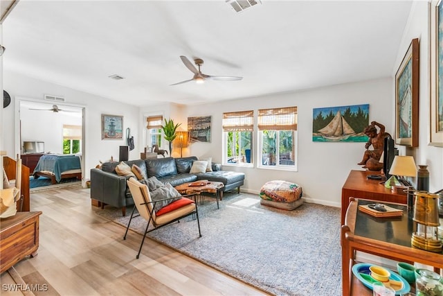 5228 Stringfellow Rd, Saint James City, FL 33956 - living area featuring a ceiling fan and light wood-style floors