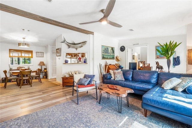 5228 Stringfellow Rd, Saint James City, FL 33956 - living area featuring light wood-style flooring, a ceiling fan, and beamed ceiling
