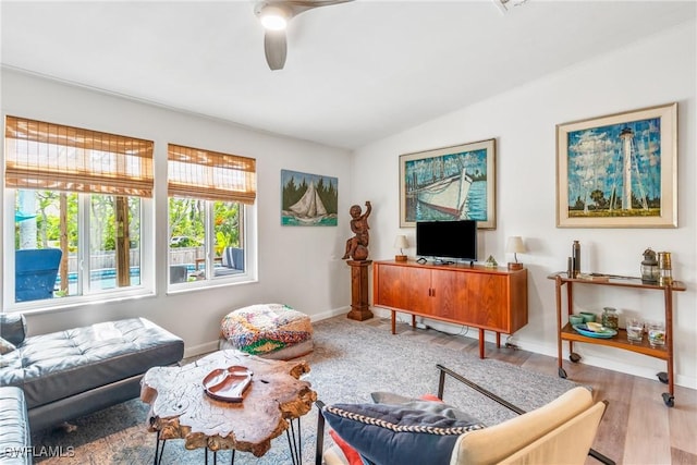 5228 Stringfellow Rd, Saint James City, FL 33956 - living room featuring a ceiling fan, wood finished floors, and lofted ceiling