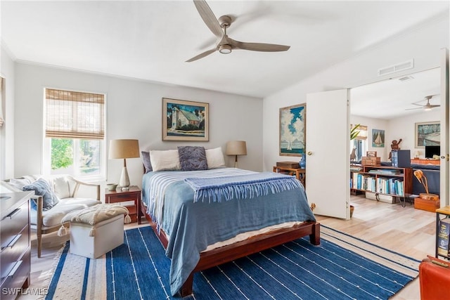 5228 Stringfellow Rd, Saint James City, FL 33956 - bedroom with wood finished floors, vaulted ceiling, and a ceiling fan