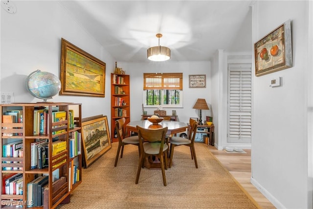 5228 Stringfellow Rd, Saint James City, FL 33956 - dining room with light wood-style floors and baseboards