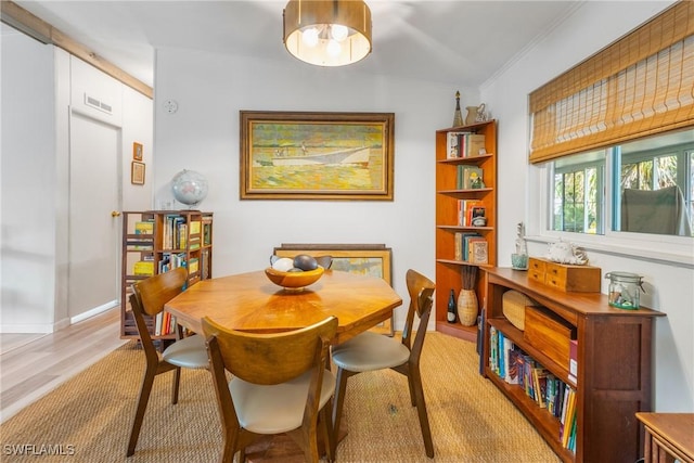 5228 Stringfellow Rd, Saint James City, FL 33956 - dining room with light wood-type flooring and crown molding