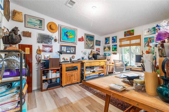 5228 Stringfellow Rd, Saint James City, FL 33956 - office with a textured ceiling and light wood-style floors