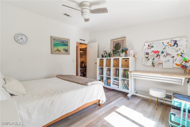 5228 Stringfellow Rd, Saint James City, FL 33956 - bedroom with wood finished floors and ceiling fan