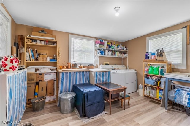 5228 Stringfellow Rd, Saint James City, FL 33956 - laundry area with washing machine and clothes dryer and wood finished floors