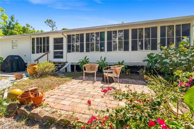 5228 Stringfellow Rd, Saint James City, FL 33956 - back of property with entry steps and a patio