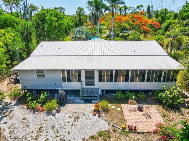 5228 Stringfellow Rd, Saint James City, FL 33956 - back of house with a patio and a metal roof