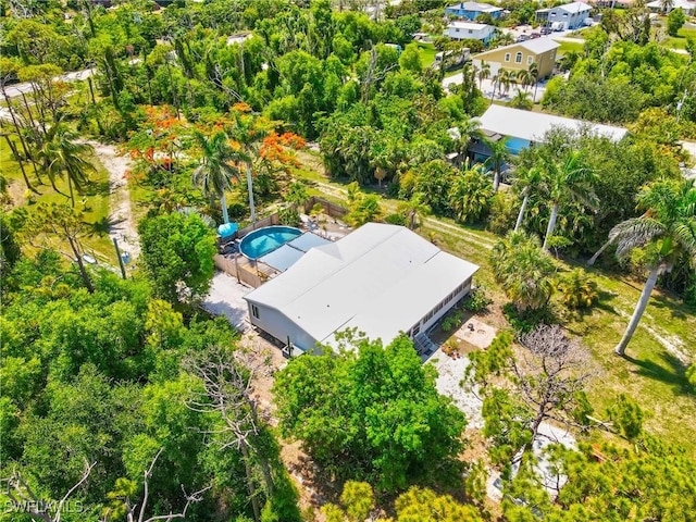 5228 Stringfellow Rd, Saint James City, FL 33956 - bird's eye view of a pool area and a tree filled landscape