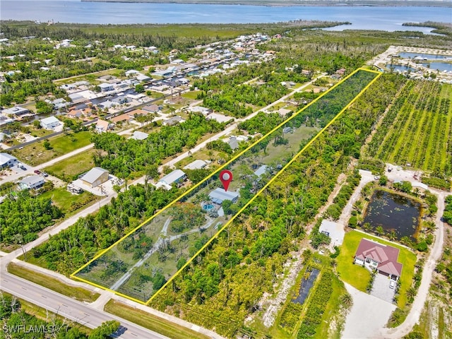 5228 Stringfellow Rd, Saint James City, FL 33956 - aerial view of residential area featuring a large body of water and property boundaries highlighted