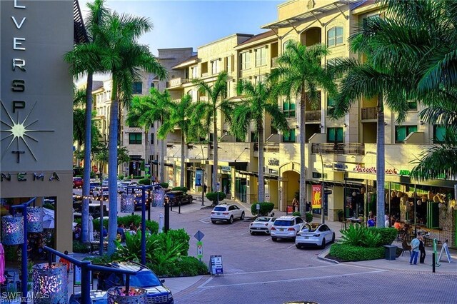 4635 Saint Croix Ln Unit 1222, Naples, FL 34109 - view of property featuring uncovered parking