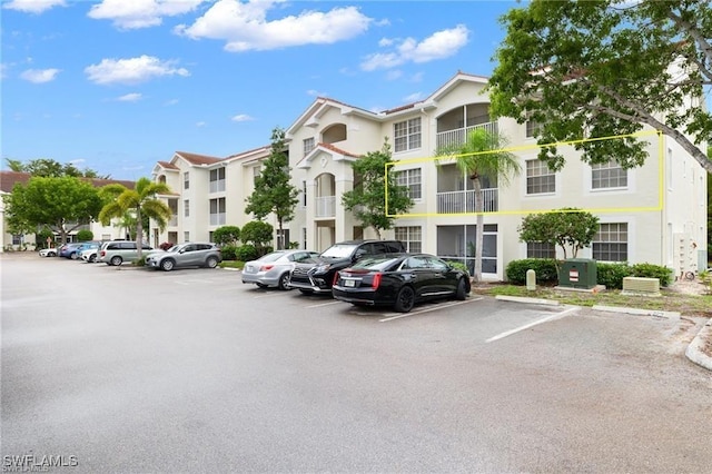 4635 Saint Croix Ln Unit 1222, Naples, FL 34109 - view of building exterior featuring uncovered parking