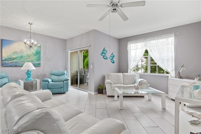 4635 Saint Croix Ln Unit 1222, Naples, FL 34109 - living room with plenty of natural light, ceiling fan, a chandelier, and baseboards