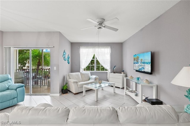 4635 Saint Croix Ln Unit 1222, Naples, FL 34109 - living room featuring a ceiling fan and baseboards