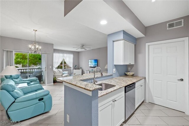 4635 Saint Croix Ln Unit 1222, Naples, FL 34109 - kitchen featuring open floor plan, stainless steel dishwasher, a sink, white cabinets, and recessed lighting