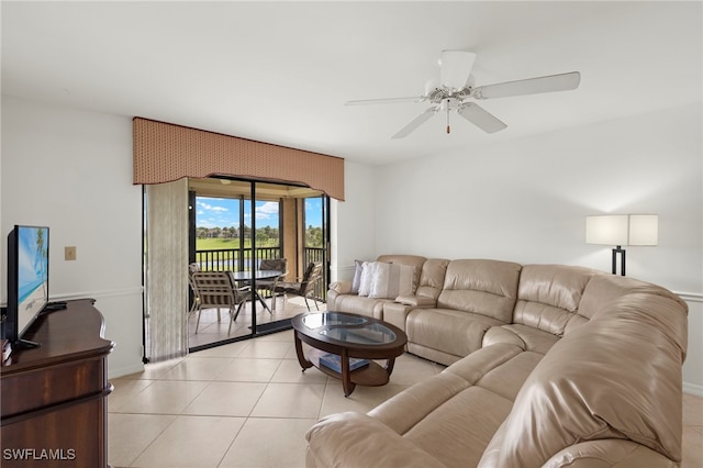 12170 Kelly Sands Way Unit 721, Fort Myers, FL 33908 - living room with ceiling fan, light tile patterned floors, and baseboards