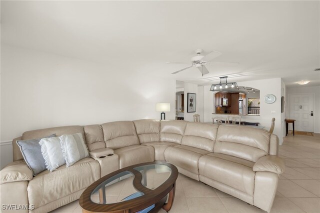 12170 Kelly Sands Way Unit 721, Fort Myers, FL 33908 - living area featuring a ceiling fan and light tile patterned floors